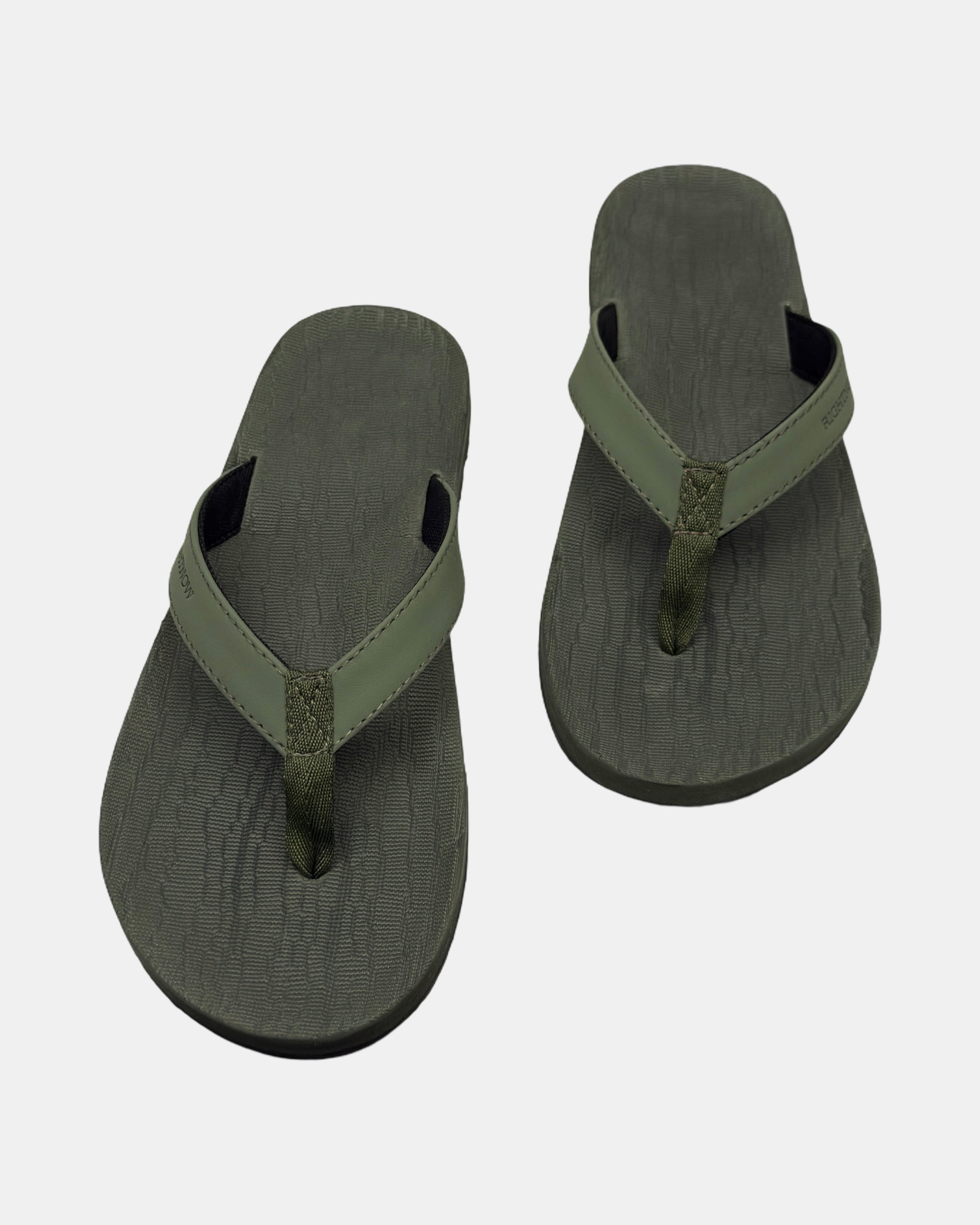 Front view of a pair of natural green rubber men’s thong sandal with open-toe design and textured footbed.