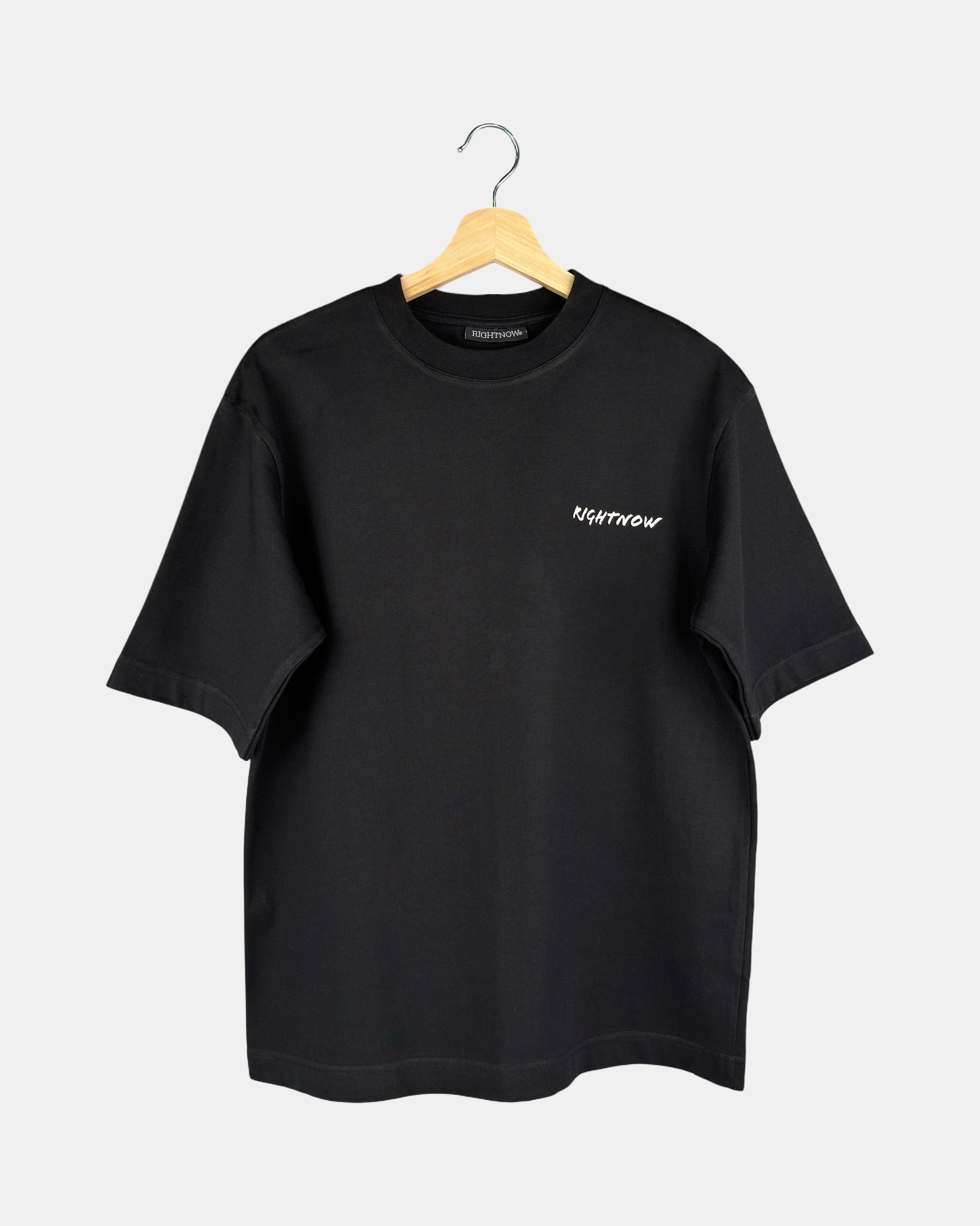 Unisex matt black Moment oversized t-shirt in premium cotton with the RIGHTNOW brand name printed on the chest, below the butterfly-knitted crewneck collar.