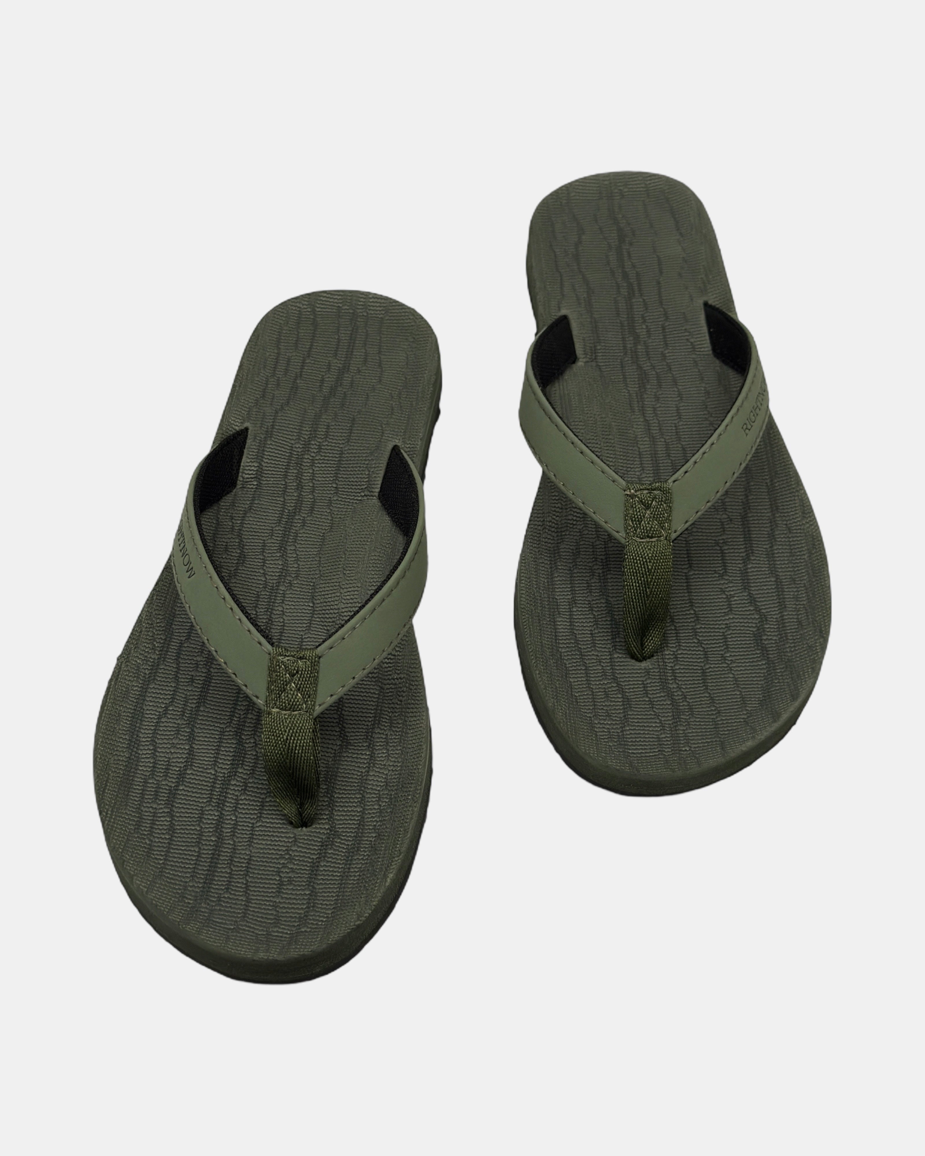 Front view of a pair of natural green rubber women’s thong sandal with open-toe design and textured footbed.