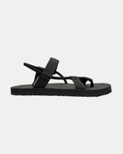Men's matt black rubber Roman sandal seen from the right side, with Rottan-like adjustable strap on the ankle.