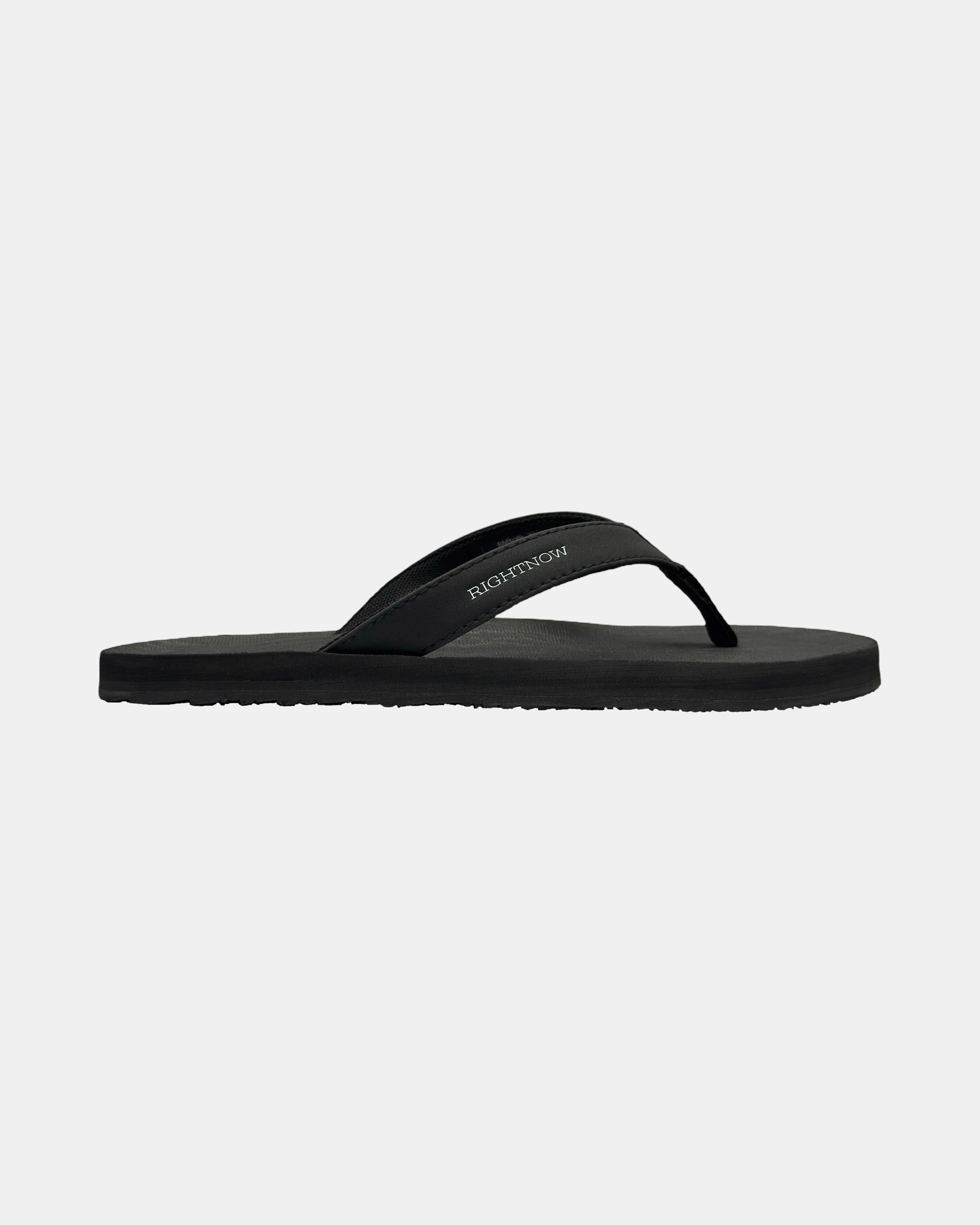 Men's matt black rubber Thong sandal seen from the right side, showing the slim profile of the sole and V-shaped strap.