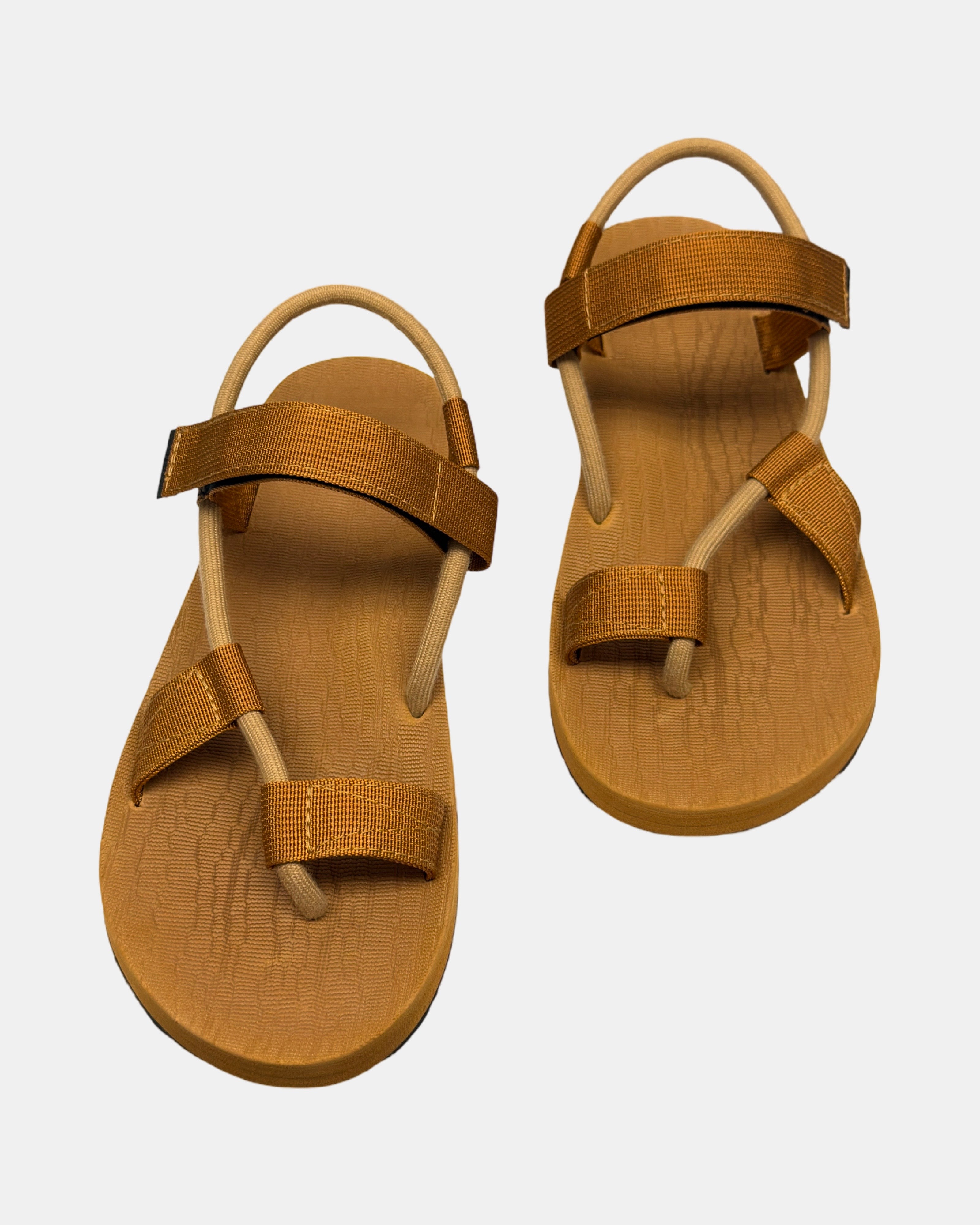 Front view of a pair of earth brown rubber men's roman sandal with open-toe design and adjustable ankle strap.