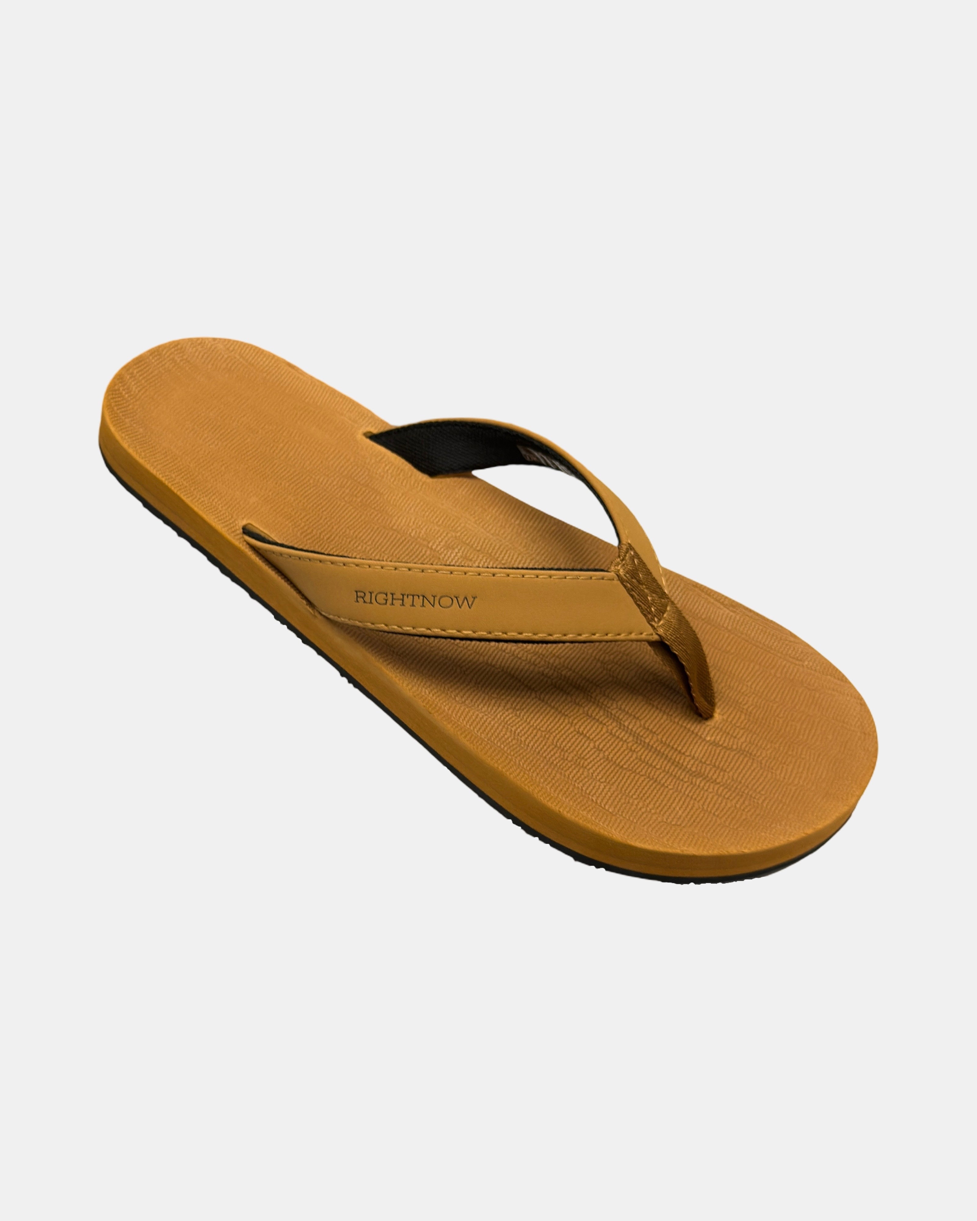 A 45-degree angled view of a men's earth brown rubber Thong-style sandal highlighting its textured and supportive footbed.