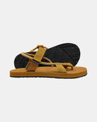 Men's earth-tone minimalist sandal with flexible strap and an open-toe design, with the black rubber textured anti-slip sole behind it.
