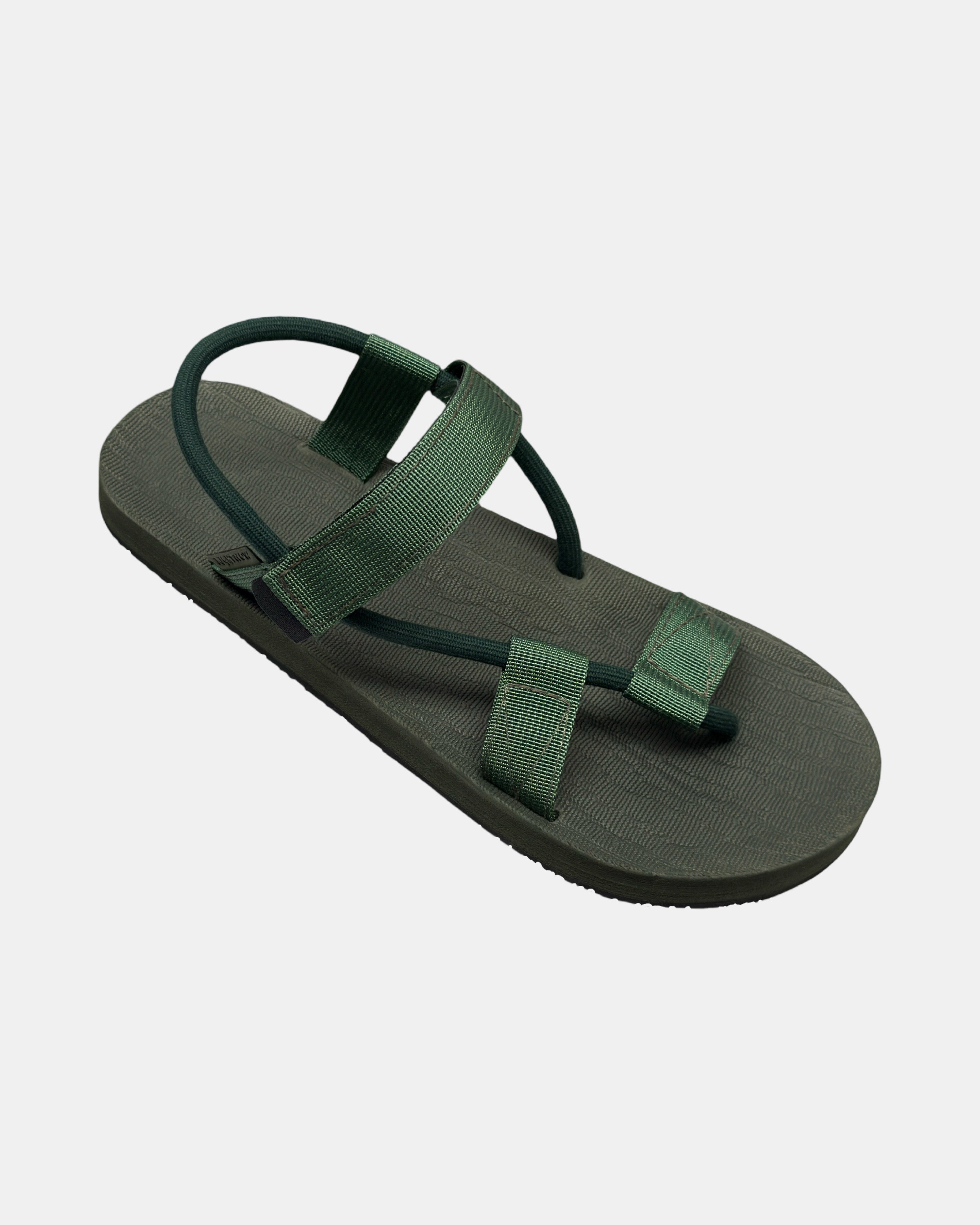 A 45-degree angled view of a men's natural green rubber Roman-style sandal with a single 360° flexible strap around the ankle.