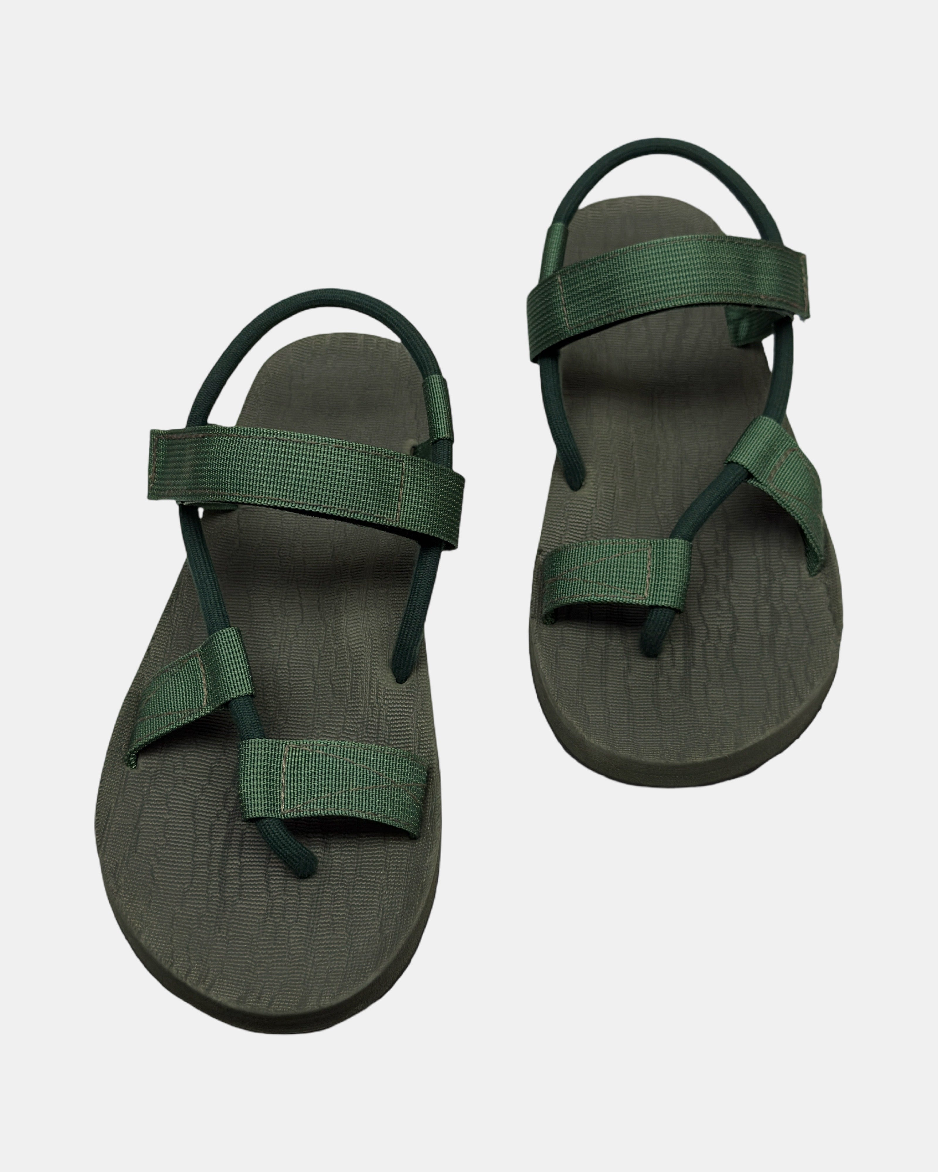 Front view of a pair of natural green rubber men's roman sandal with open-toe design and adjustable ankle strap.