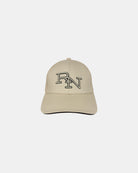 Front view of a sand beige minimalist baseball cap featuring the ‘RN’ logo in black outline embroidery for simple, everyday style.