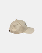 Right side profile of a sand beige RN logo baseball cap, highlighting its minimalist design and breathable cotton twill fabric.