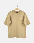 Unisex sand beige Moment oversized t-shirt in premium cotton with the RIGHTNOW brand name printed on the chest, below the butterfly-knitted crewneck collar.