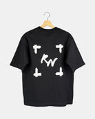 Back view of a unisex matt black Moment oversized t-shirt in premium cotton, showing a large canvas-style graphic with a deep, expansive, and line-less design.