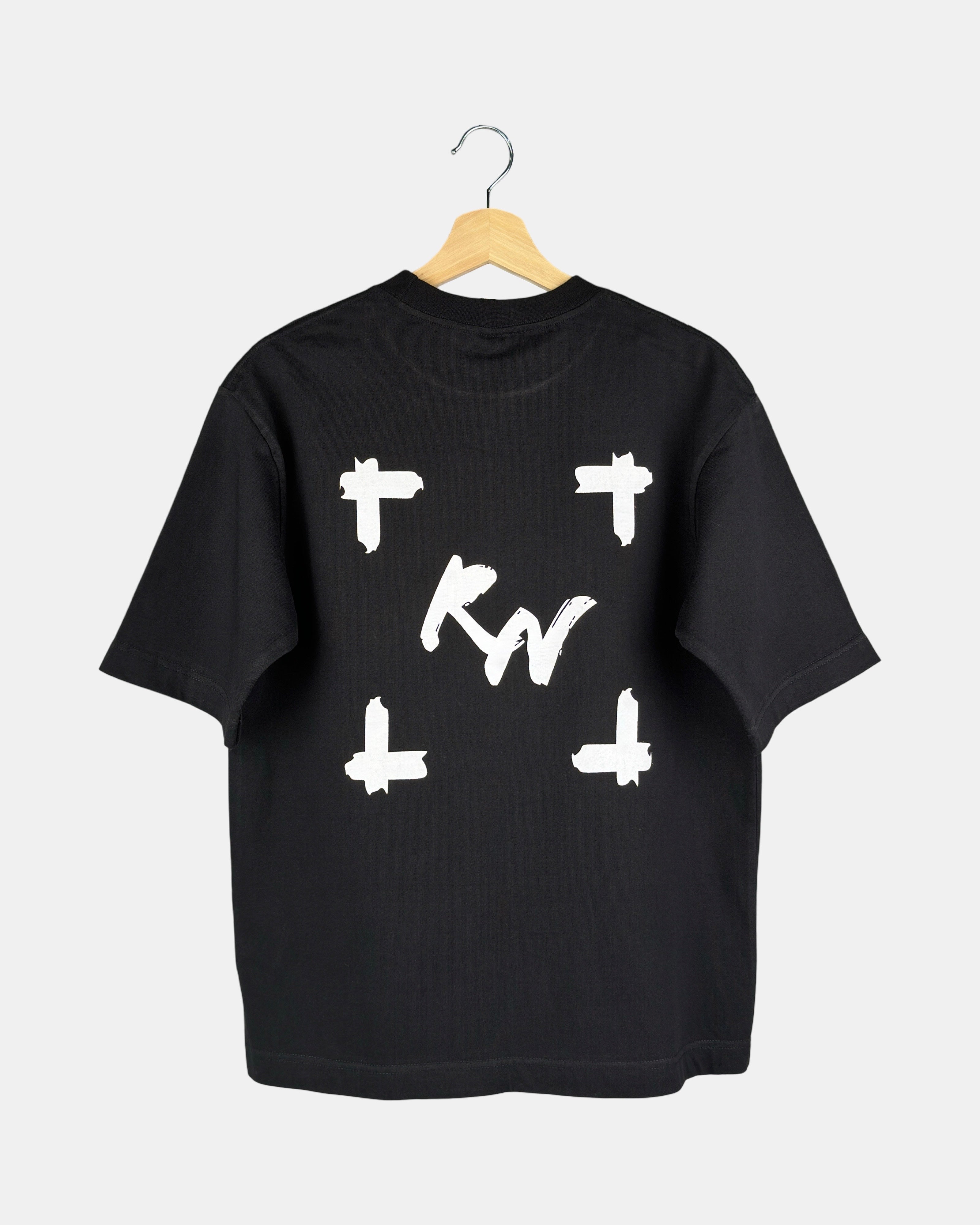 Back view of a unisex matt black Moment oversized t-shirt in premium cotton, showing a large canvas-style graphic with a deep, expansive, and line-less design.