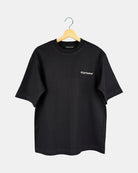 Unisex matt black Moment oversized t-shirt in premium cotton with the RIGHTNOW brand name printed on the chest, below the butterfly-knitted crewneck collar.