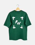 Back view of a unisex natural green Moment oversized t-shirt in premium cotton, showing a large canvas-style graphic with a deep, expansive, and line-less design.