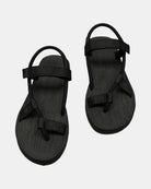 Front view of a pair of matt black rubber women’s roman sandal with open-toe design and adjustable ankle strap.