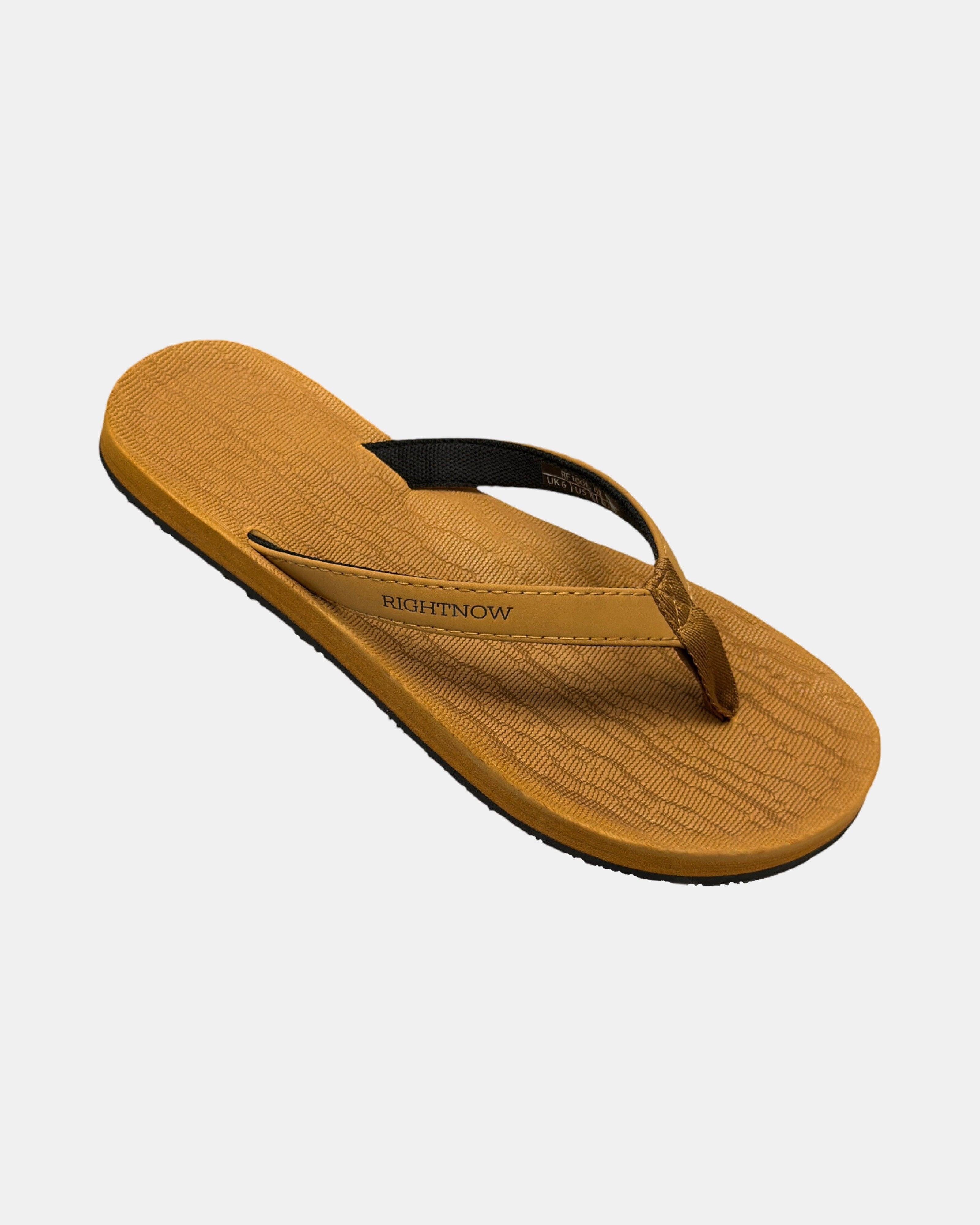 A 45-degree angled view of a women's earth brown rubber Thong-style sandal highlighting its textured and supportive footbed.