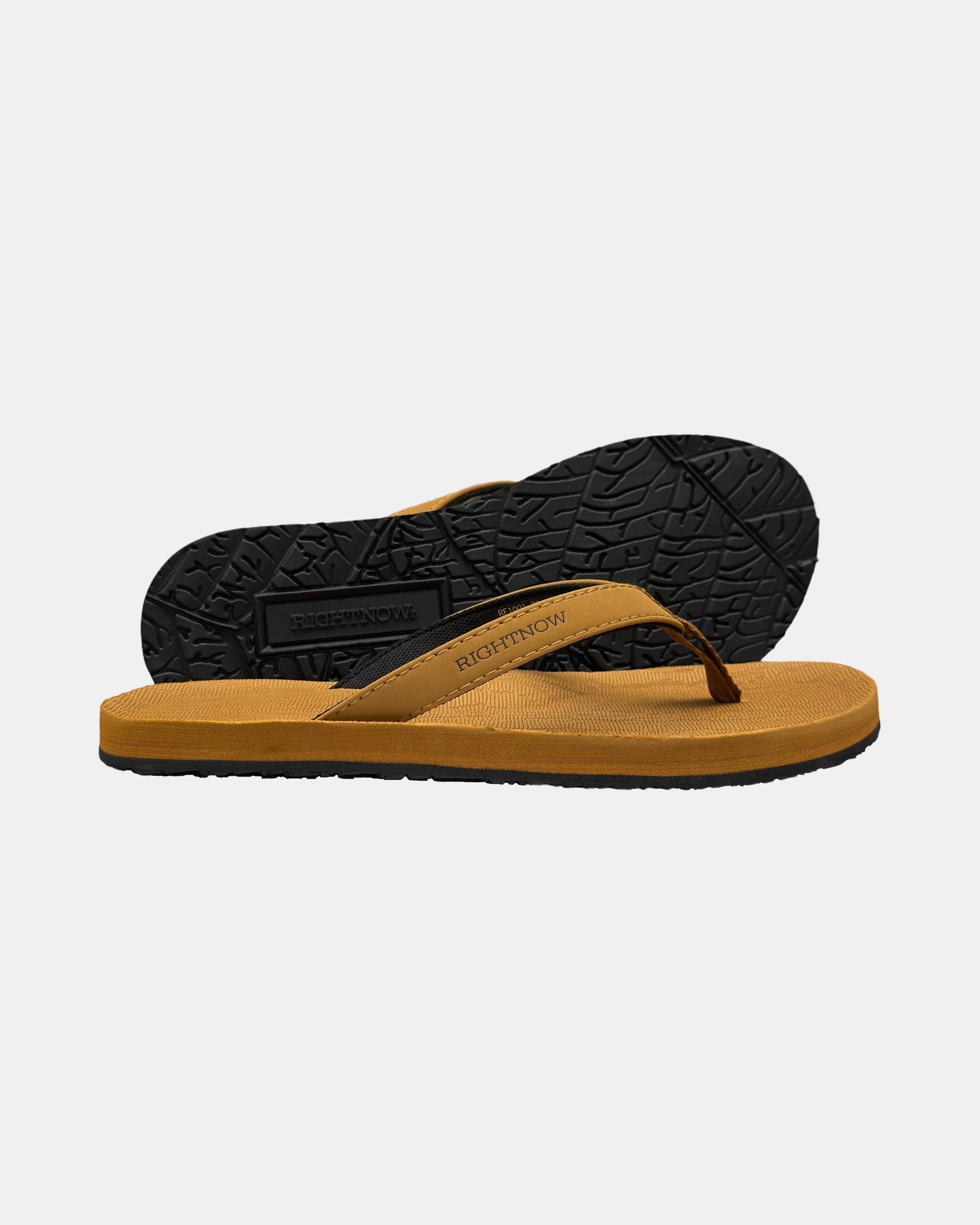 Women's earth-tone minimalist thong sandal with V-shaped strap and an open-toe design, with the black rubber textured anti-slip sole behind it.