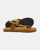 Women's earth-tone minimalist sandal with flexible strap and an open-toe design, with the black rubber textured anti-slip sole behind it.