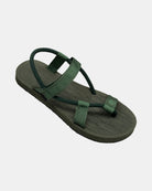 A 45-degree angled view of a women's natural green rubber Roman-style sandal with a single 360° flexible strap around the ankle.