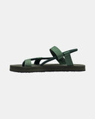 Women's natural green rubber Roman-style sandal seen from the left side, highlighting the contoured and grooved topsole with embedded arch support.