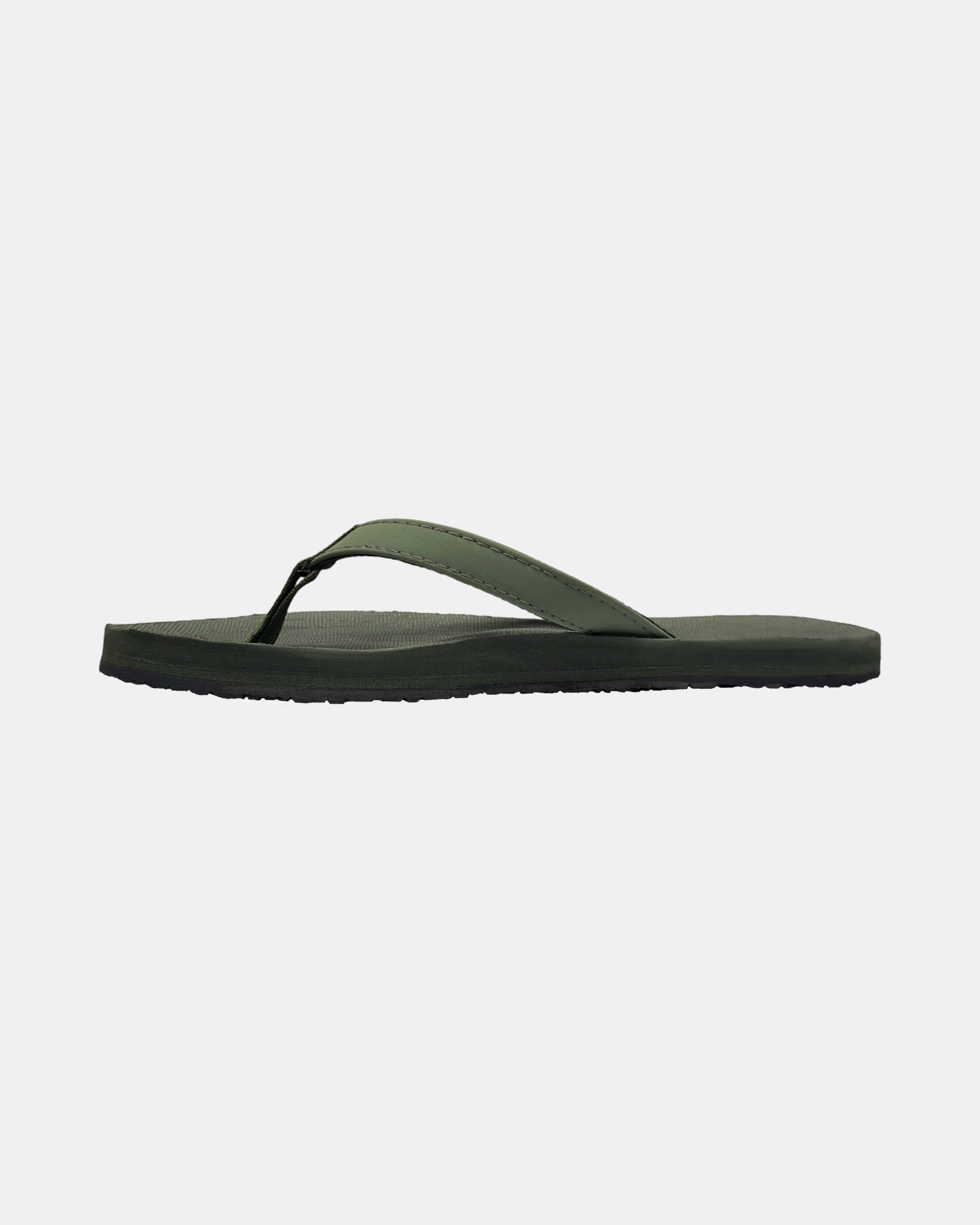Women's natural green rubber Thong-style sandal seen from the left side, highlighting the contoured and grooved topsole with embedded arch support.